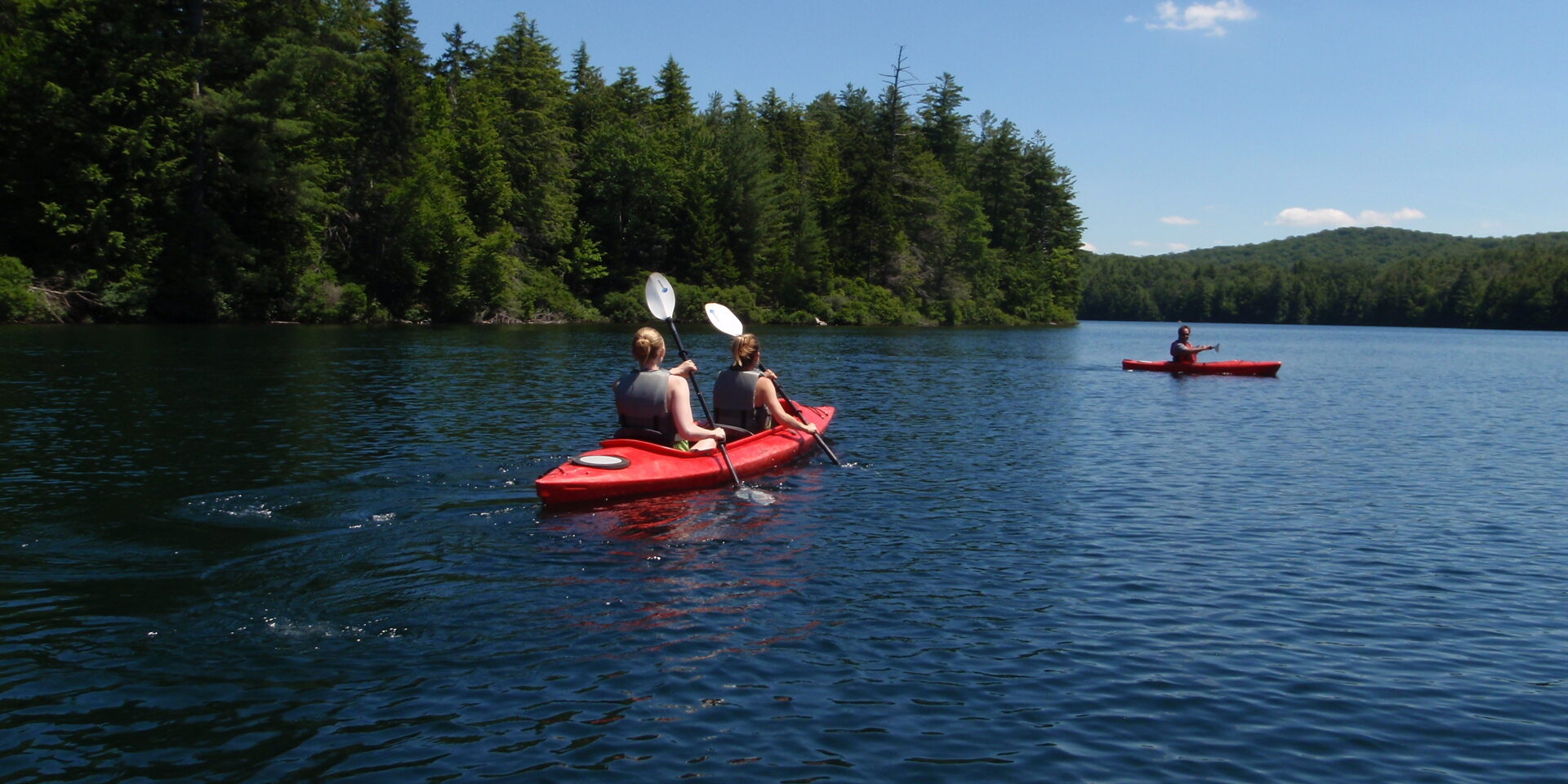 View of kayaks on lake