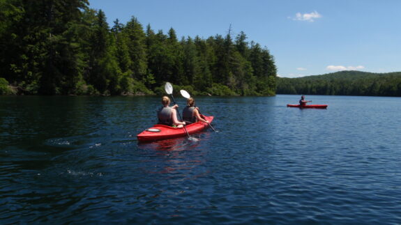 View of kayaks on lake